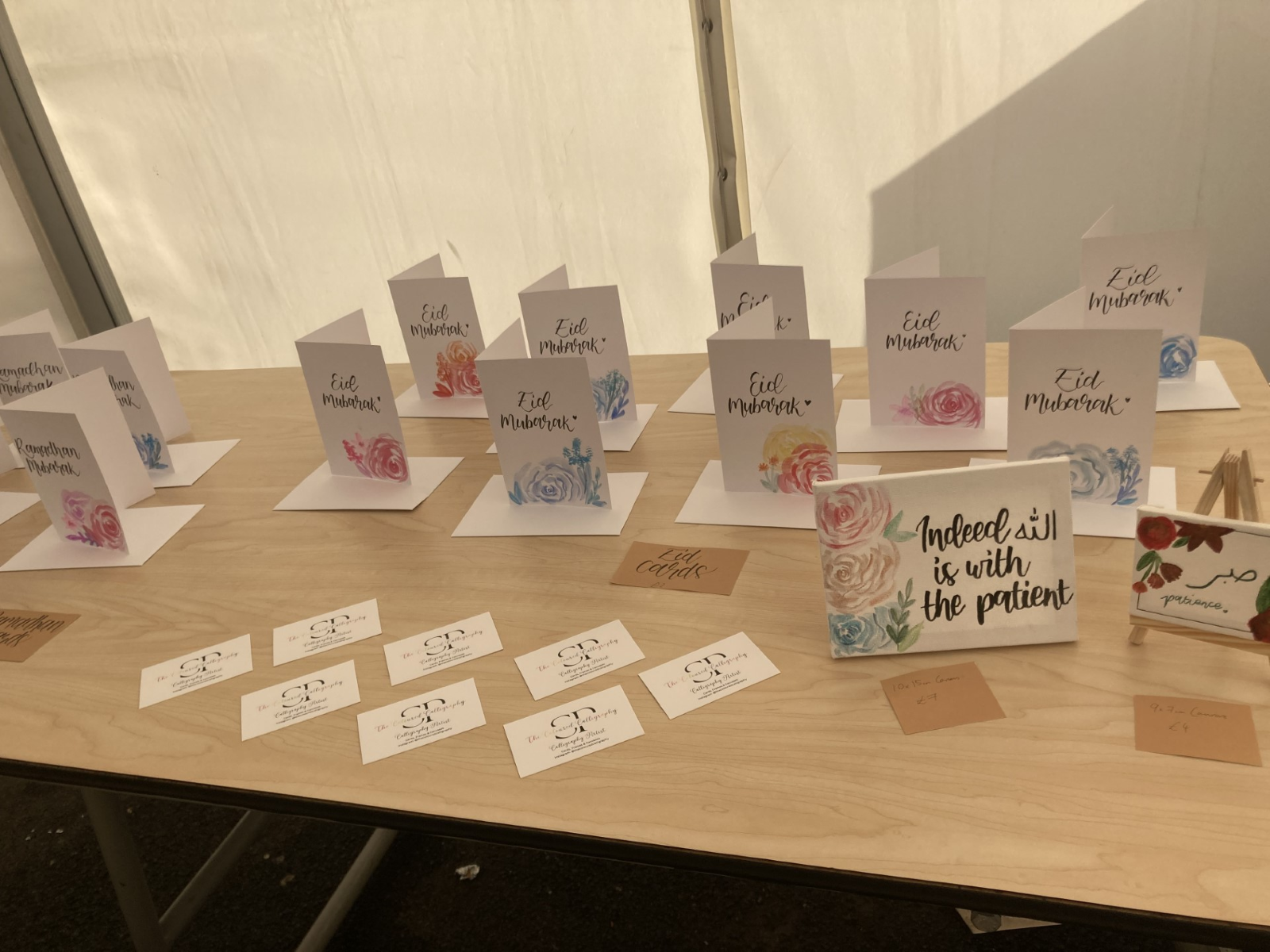 Ayah frames and watercolour bookmarks for sale at the calligraphy stall