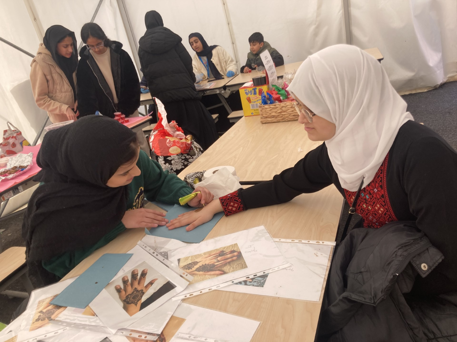 A live henna table at the culture day